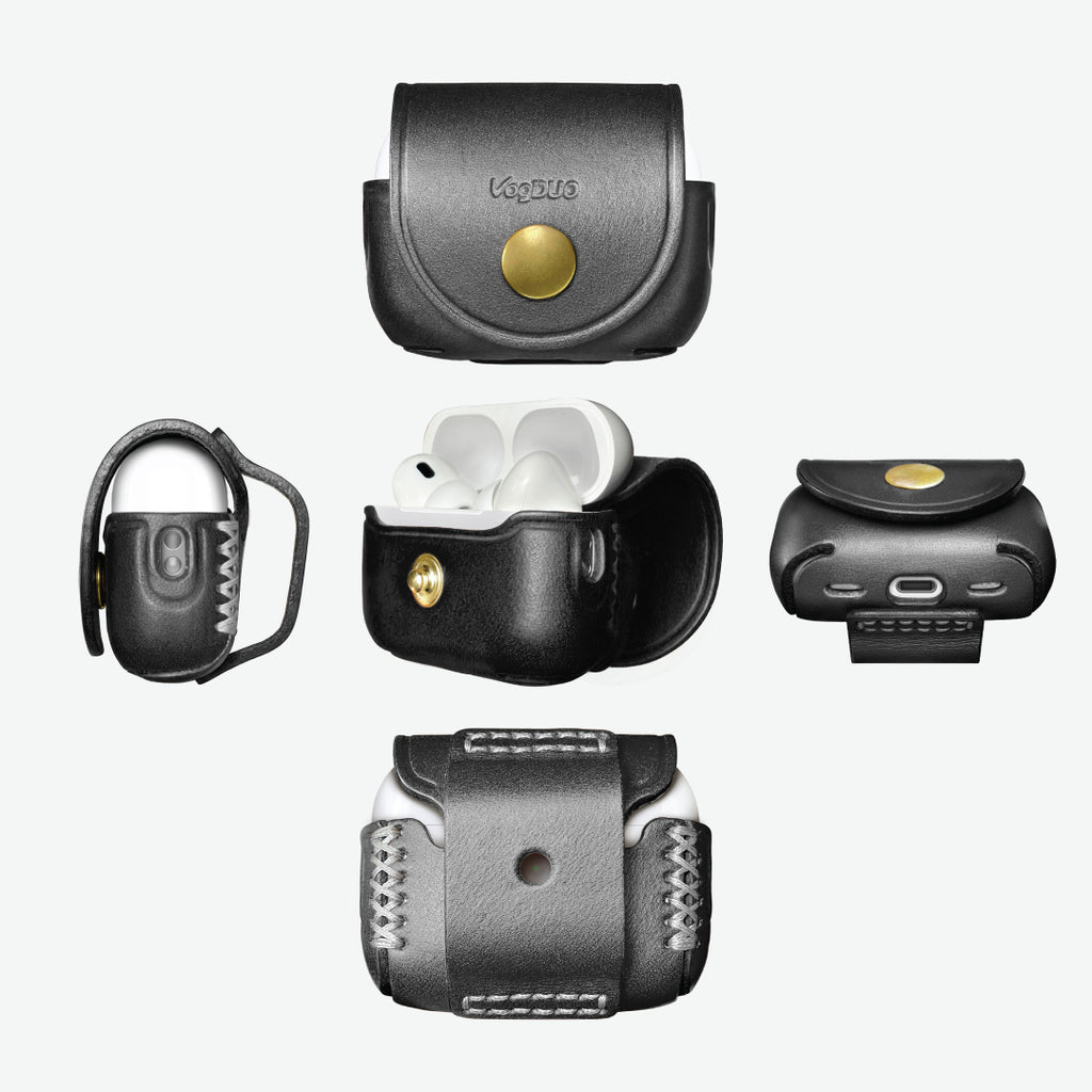 Black leather case with gold button for wireless earbuds on a white background