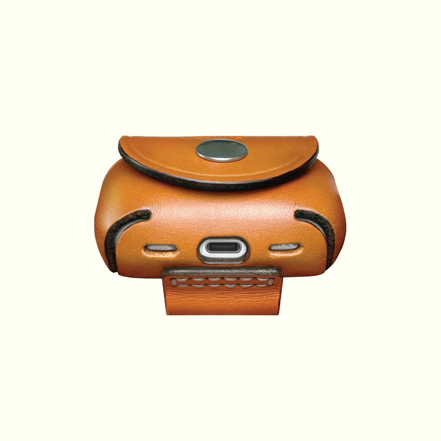 A Tan leather AirPods Pro case with a snap-button closure and a USB-C charging port.