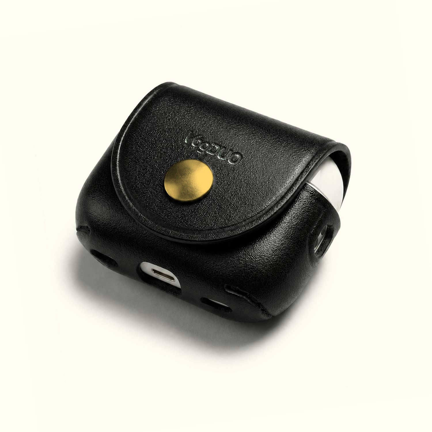 A black textured leather AirPods case with a gold snap button and debossed brand name, shown on a clean off-white background.