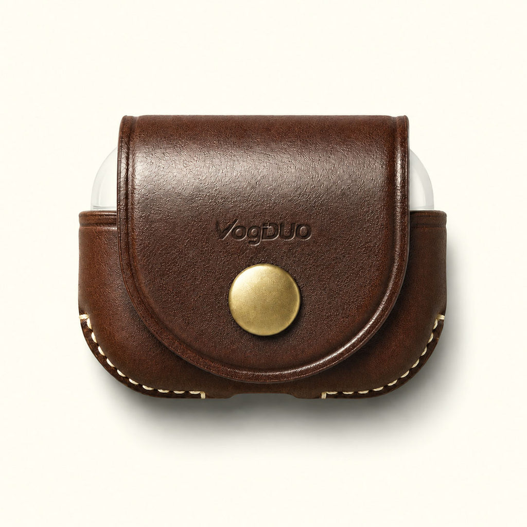 A brown leather AirPods Pro 3 case cover with a snap button closure and a brass-colored snap, featuring the VogDUO logo on the front, shown on a light cream background.