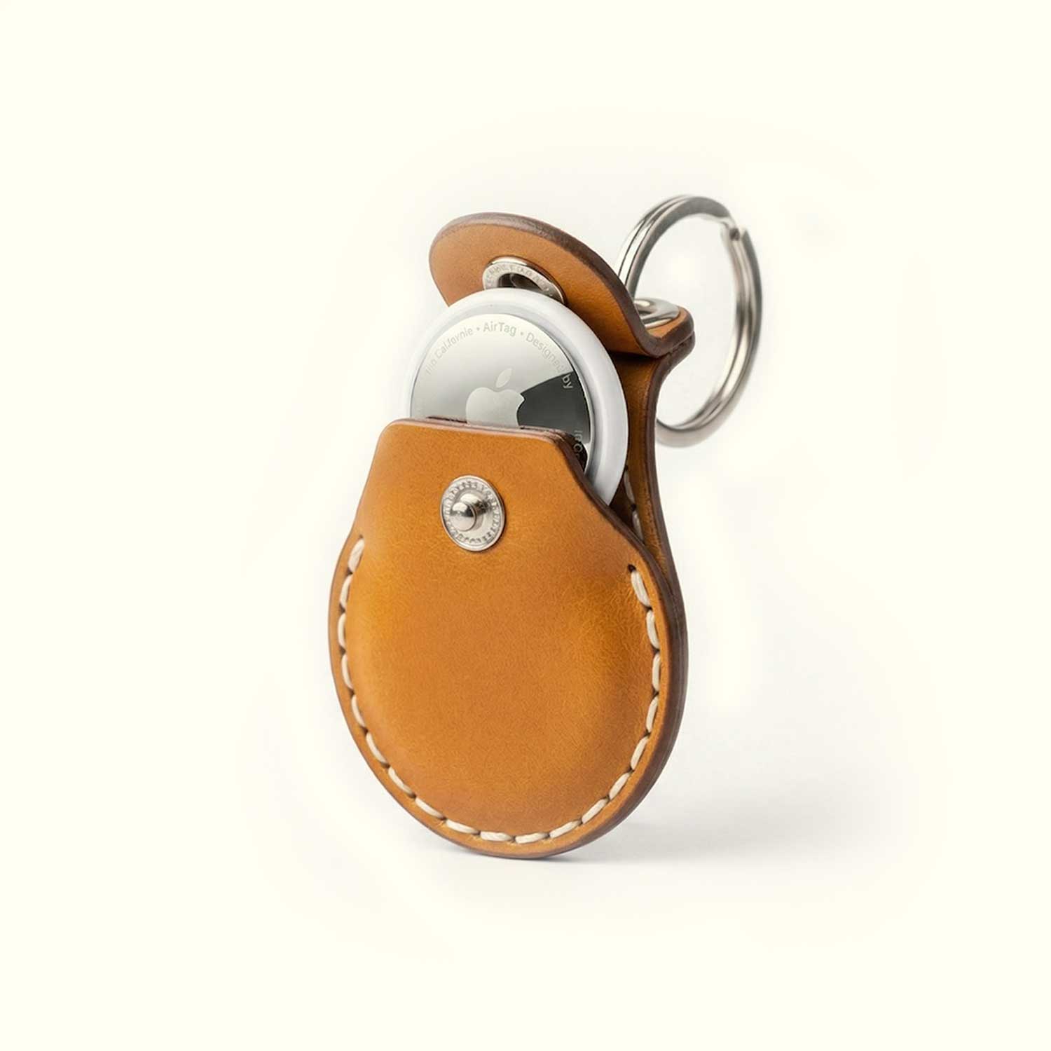 An open case of AirTag leather case