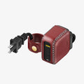 Red leather power adapter with USB ports and power extension cord with cable management on a white background