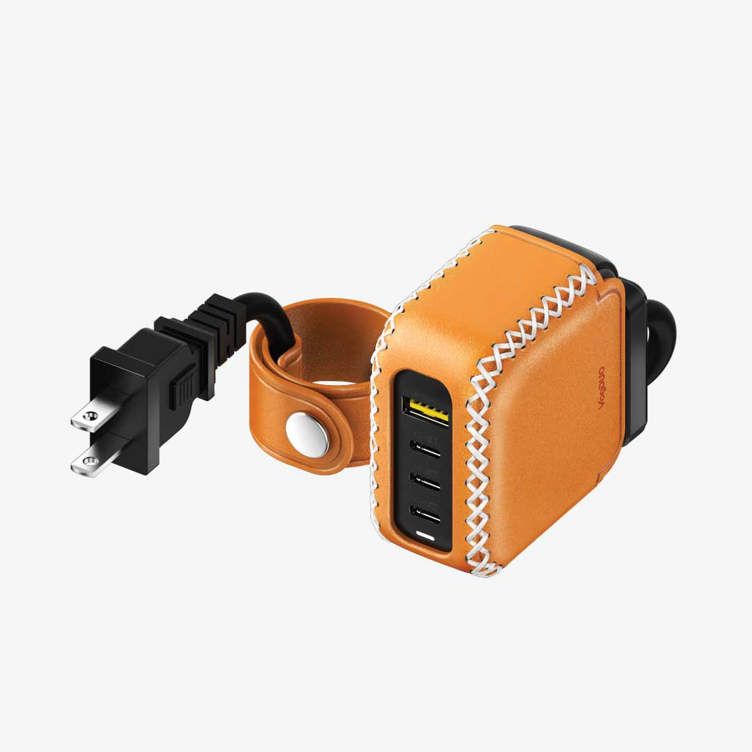 Tan leather power adapter with USB ports and power extension cord with cable management on a white background