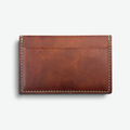 Brown Conceria Walpier Buterro leather cardholder on a white background